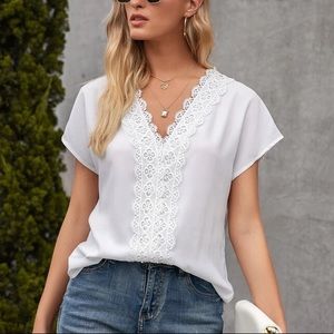 NWT white top with stitching details. Size large